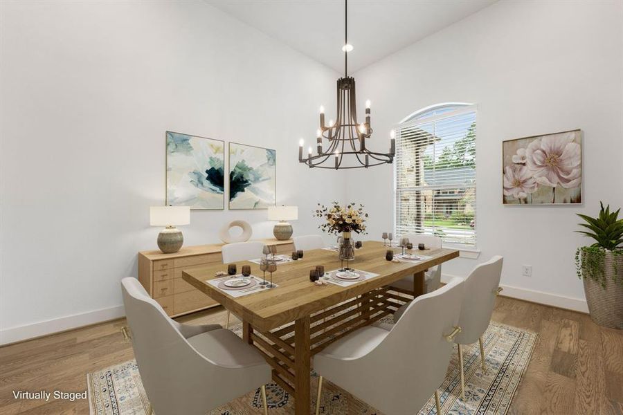 You and your guests will certainly dine in style in this amazing formal dining room! Featuring a gorgeous modern chandelier, large window with blinds, neutral paint, and high ceilings. Perfect space to entertain family and friends.