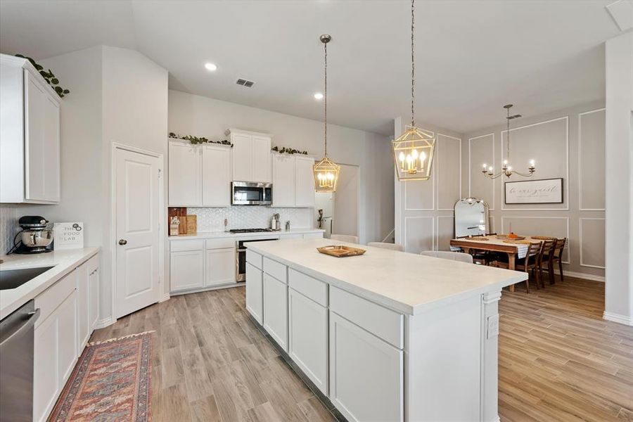 Oversized kitchen island with quartz counter tops