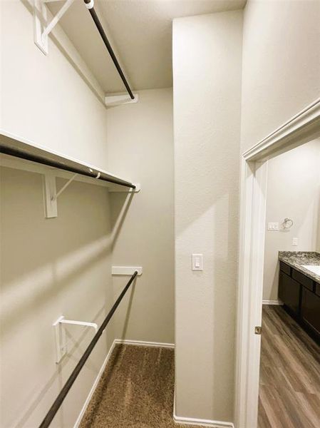 This master closet in endless- check out the 3 wardrobe racks!