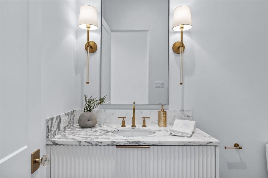 Bathroom featuring vanity and toilet