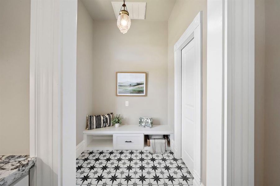 Just a quick peek into the mudroom, from the kitchen. Door on the right is the half bath. There is also a back door (not in photo) on the left, making it easy to enter/exit to the carport / backyard