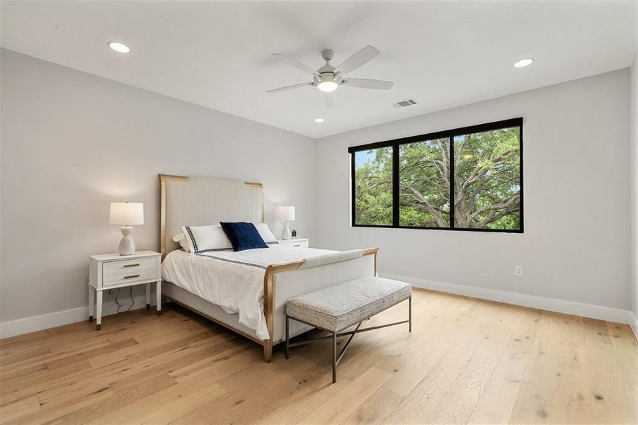 Each room is generously sized and features engineered wood flooring, contemporary ceiling fan and an ample sized closet