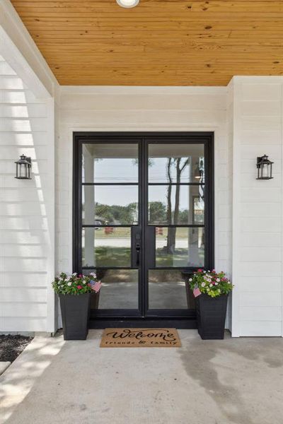 Stunning steel and glass double doors greet you upon entry.