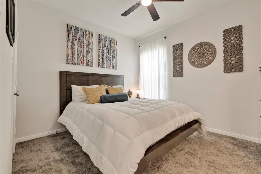 Comfortable Third Bedroom - Nice carpet, ceiling fan, and a new-home feel with upgraded features, offering comfort and style.