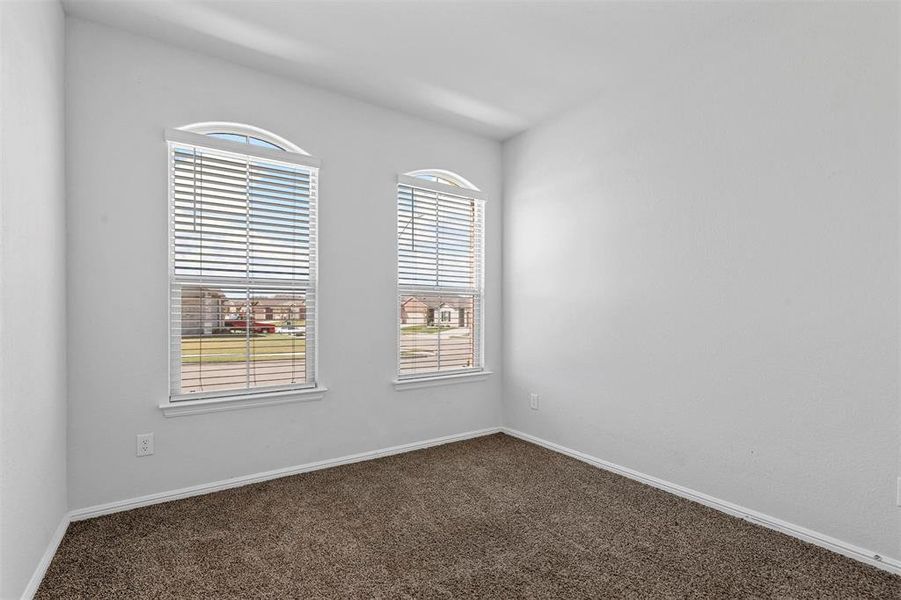 Spare room featuring carpet floors