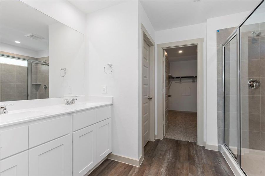 Open the Door to you Luxurious Primary Suite Bathroom with Shaker Bathroom Cabinets, Cultured Marble Countertops with Deep His and Her Undermount Sinks, Wood Vinyl Plank Floors and more! **Image Representative of Plan Only and May Vary as Built**