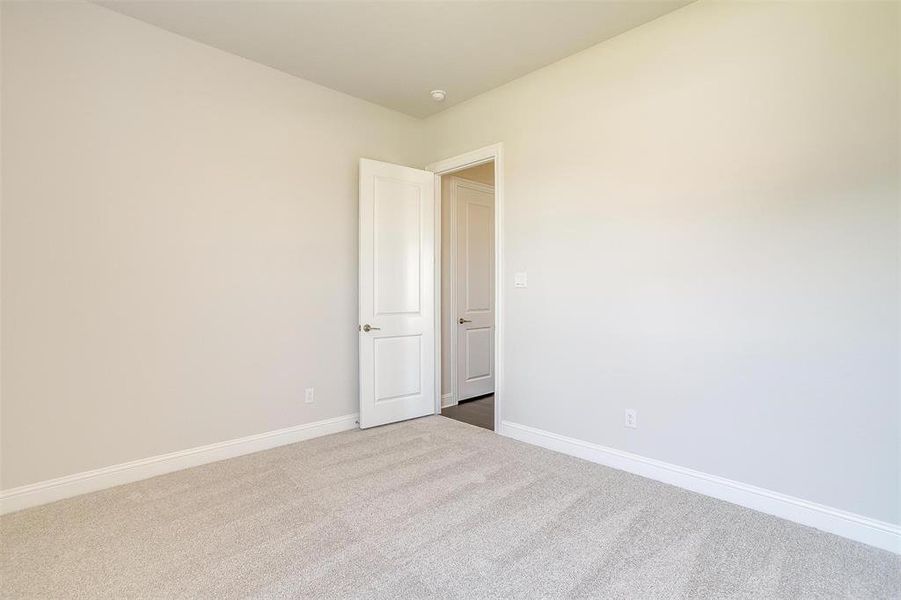 Spare room featuring carpet floors