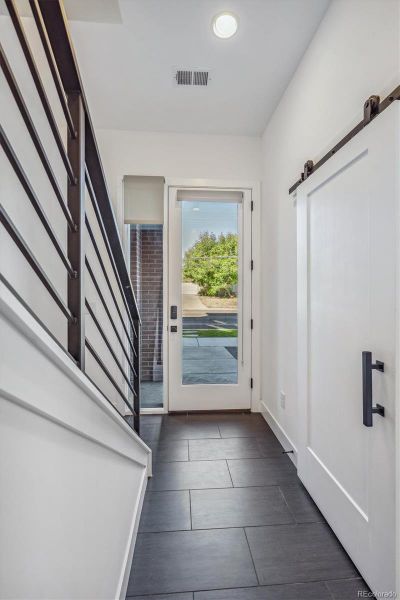 Inviting Lower-Level Entry with Tile Flooring.