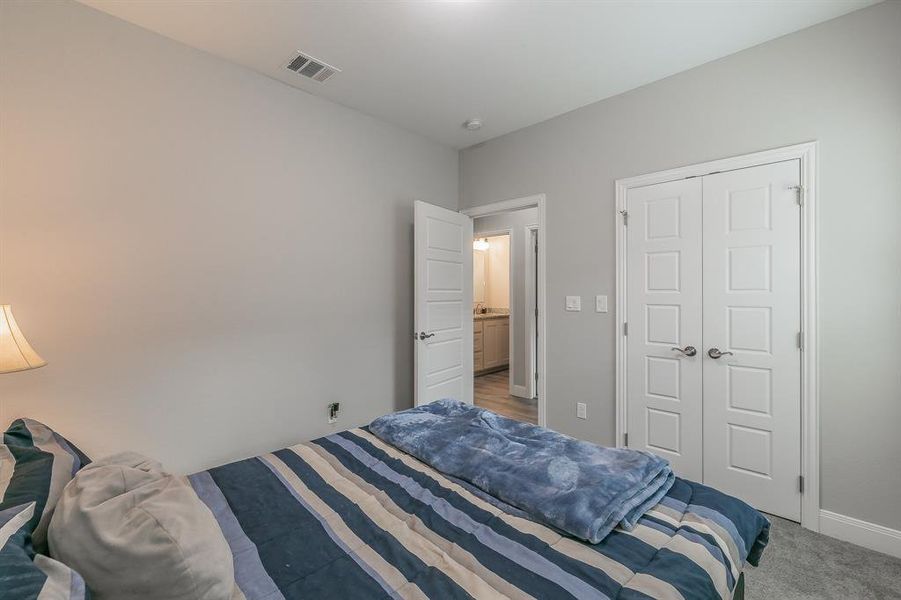 Bedroom featuring a closet and carpet floors