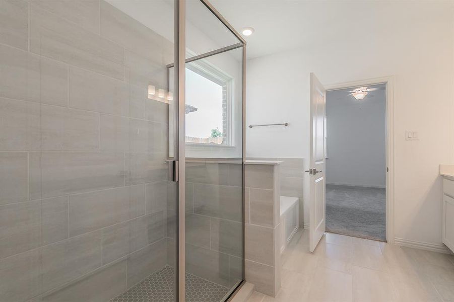 Bathroom with vanity, separate shower and tub, and tile patterned floors