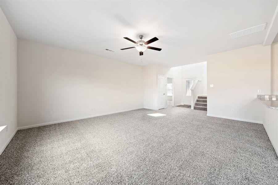 Unfurnished bedroom with carpet and ceiling fan