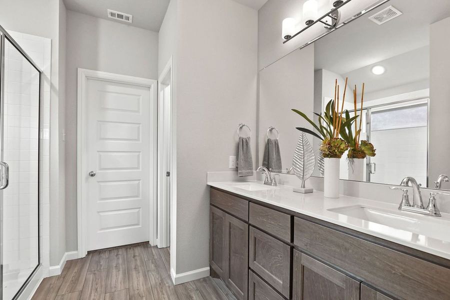 Primary bathroom in the Oscar home plan by Trophy Signature Homes – REPRESENTATIVE PHOTO
