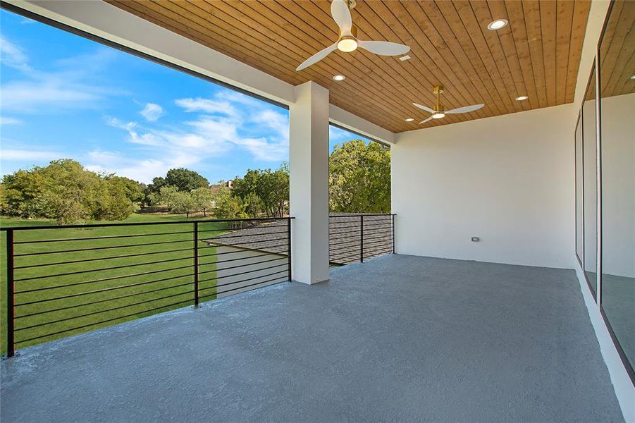 View of patio featuring a balcony and ceiling fan