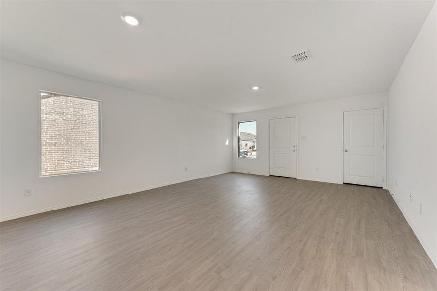 Unfurnished room with light hardwood / wood-style flooring