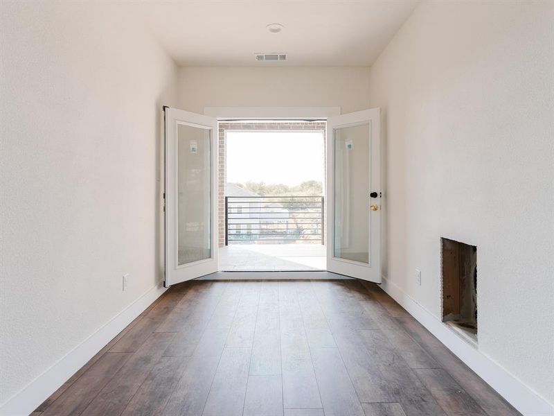 Bonus Room with dark wood-type flooring