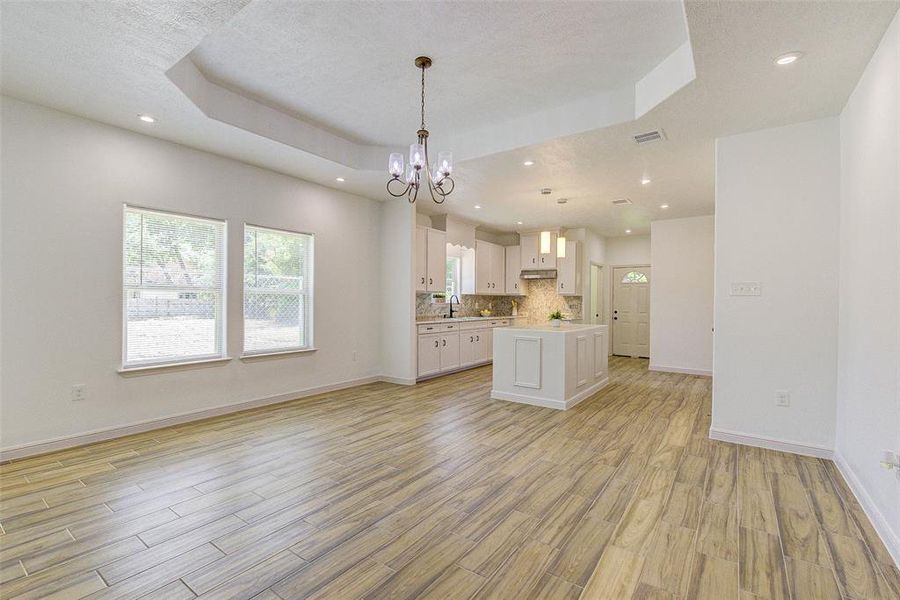 Dining area with tray ceiling open to kitchen. Great for entertaining!