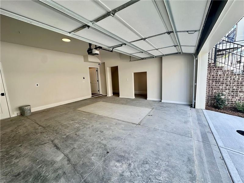 Garage access on terrace level features hose bib plus electric vehicle outlet and additional storage under the stairs