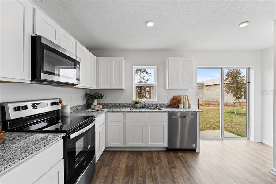 Photos are of a model home or artist rendering; any dimensions listed are approximate and may change. Home aspects and included items may vary and are not intended to form part of any contract or warranty. Home may be virtually staged.