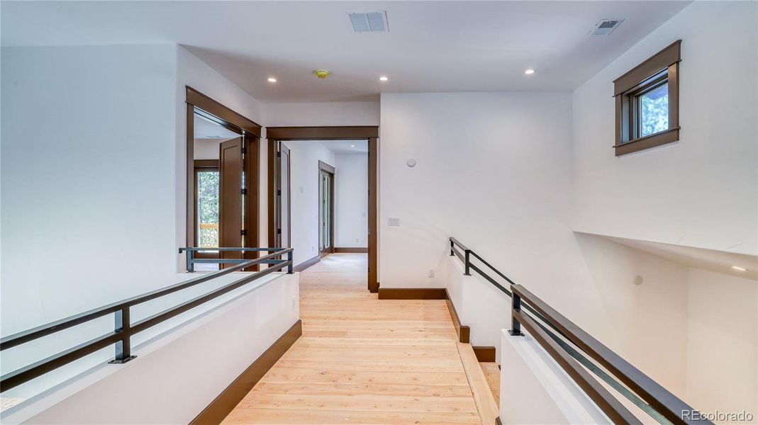 OPEN HALLWAY TO BEDROOMS AND DOWNSTAIRS AREA