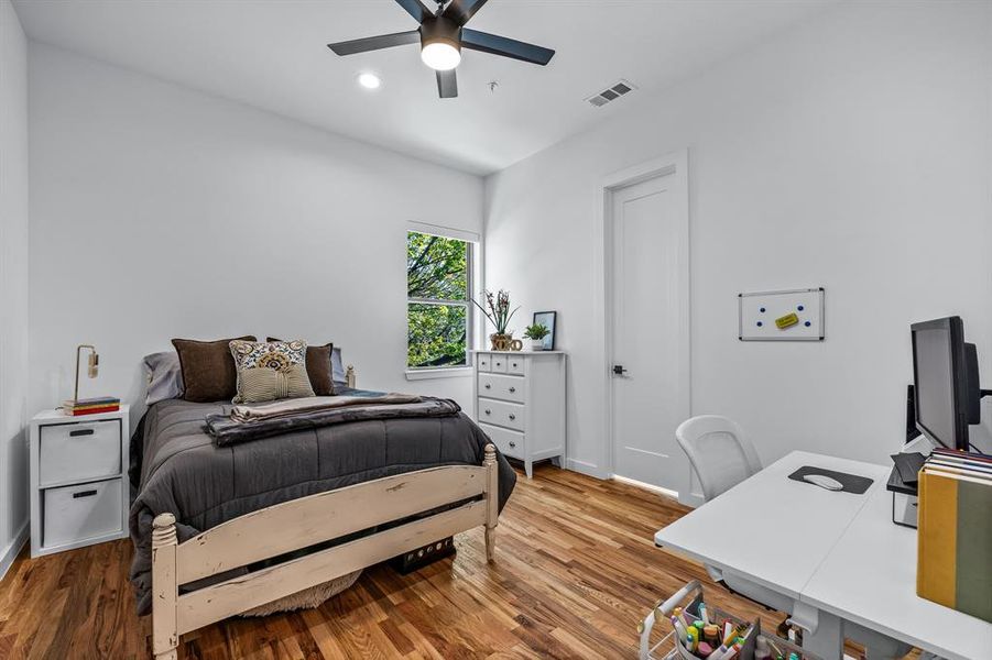 Bedroom featuring wood flooring