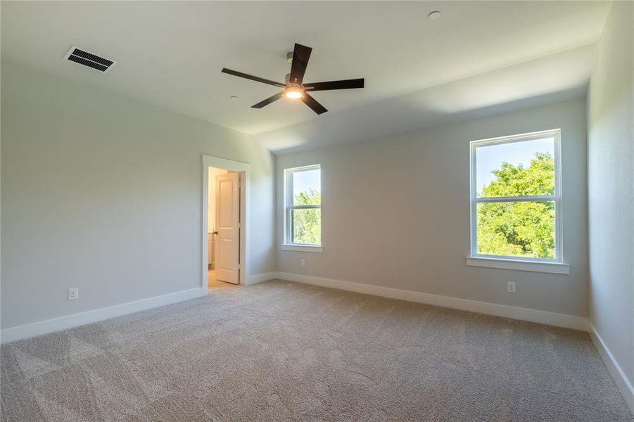 You'll enjoy the treed view from the oversized windows in this peaceful owner's suite!