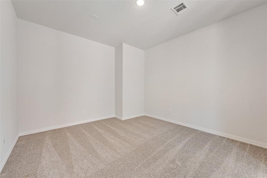 Empty room with carpet floors