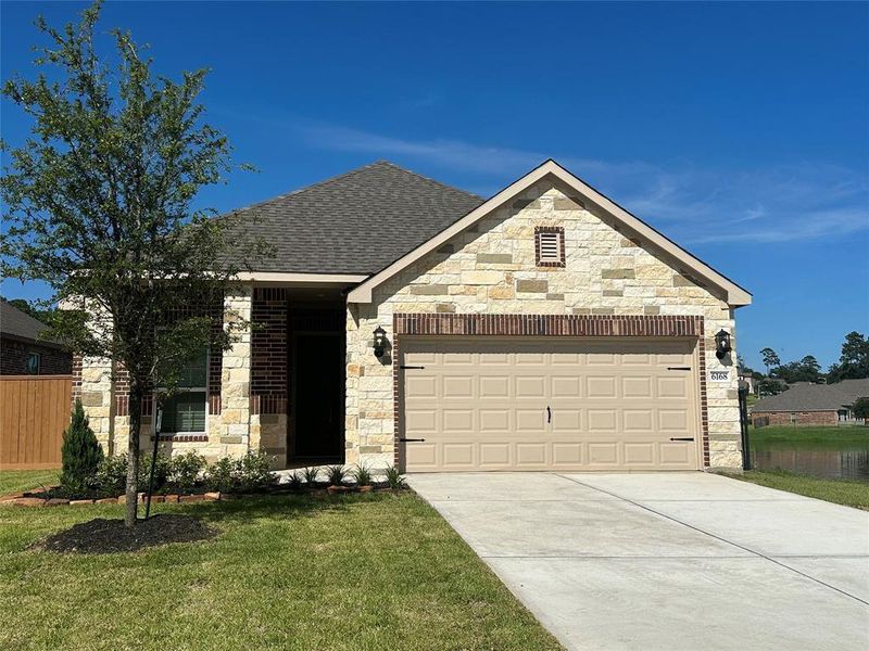 The Alder is a beautiful floorplan with a unique design combination of stone and brick.