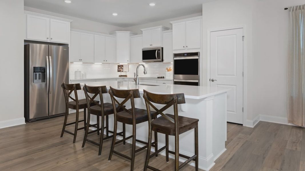 Kitchen - Cooper Model Home at The Farm at Neill's Creek by DRB Homes