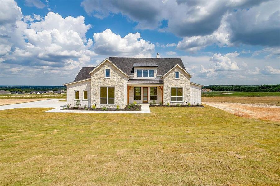 View of front of property with a front lawn