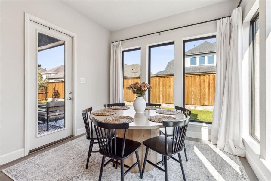 Dining area with hardwood / wood-style flooring