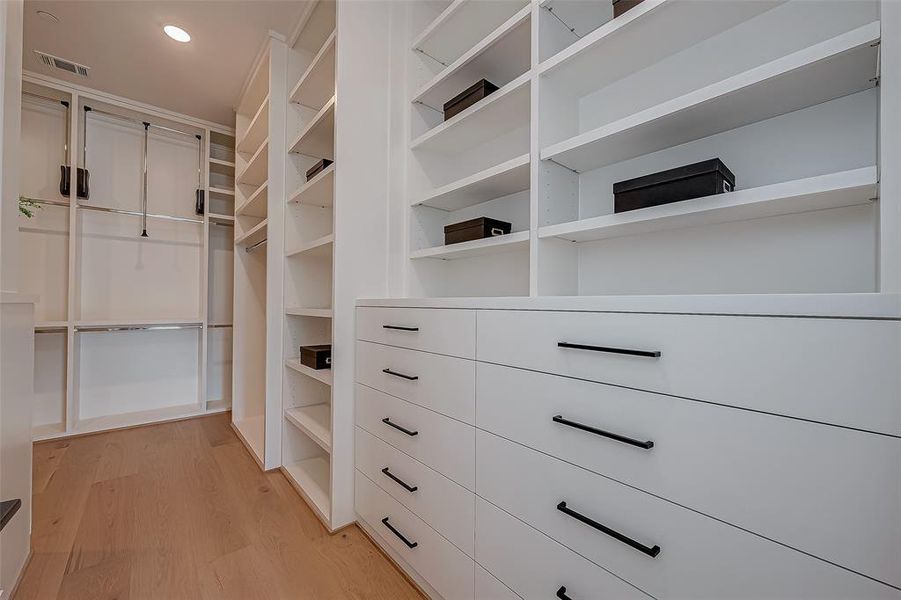 Spacious Primary Walk-In-Closet withbuilt in drawers