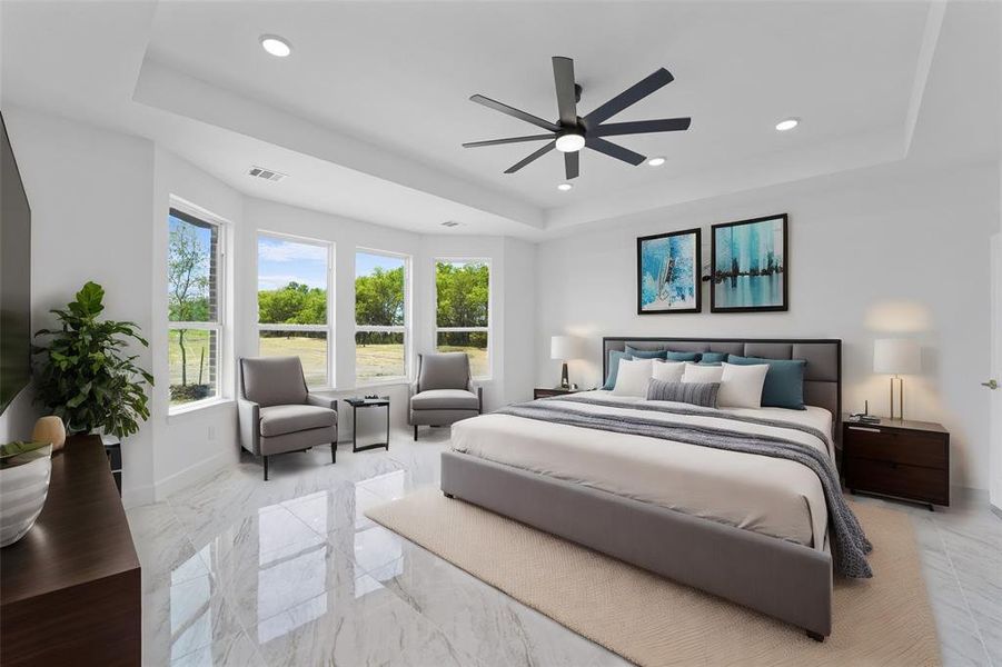 Bedroom featuring a tray ceiling and ceiling fan virtually staged