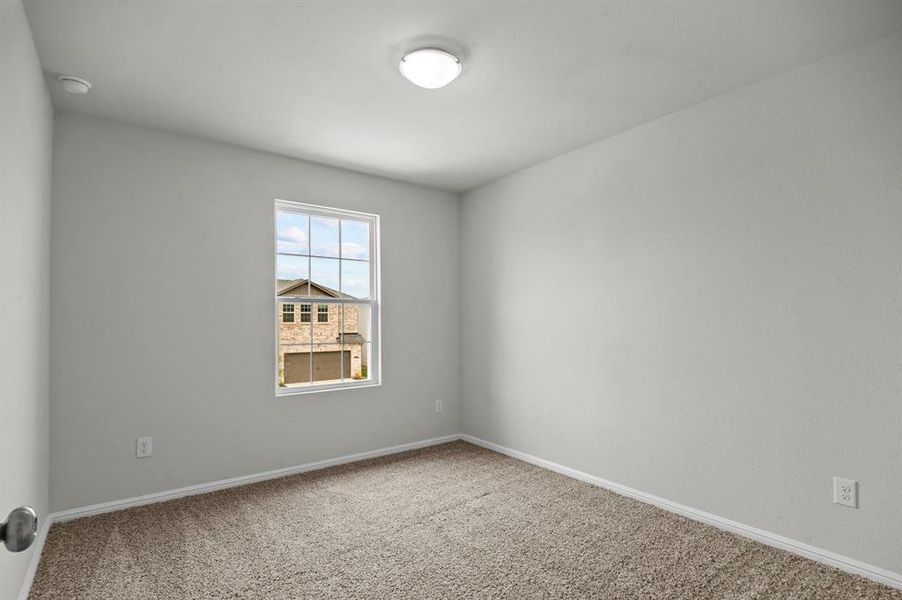 Spare room featuring carpet flooring