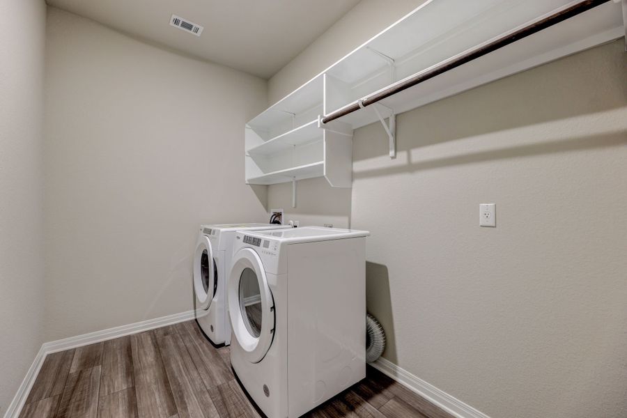 Make laundry day a breeze with this spacious laundry room.