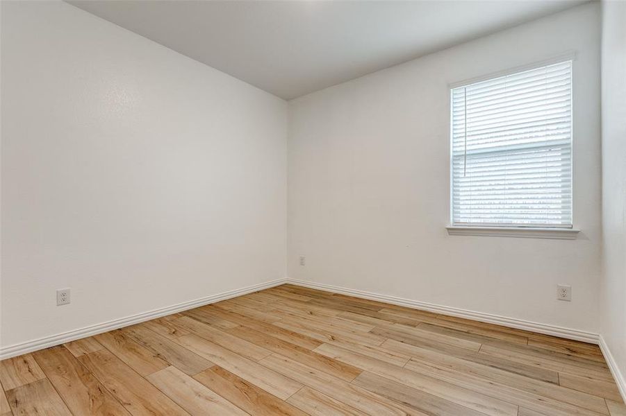 Spare room featuring light wood-type flooring