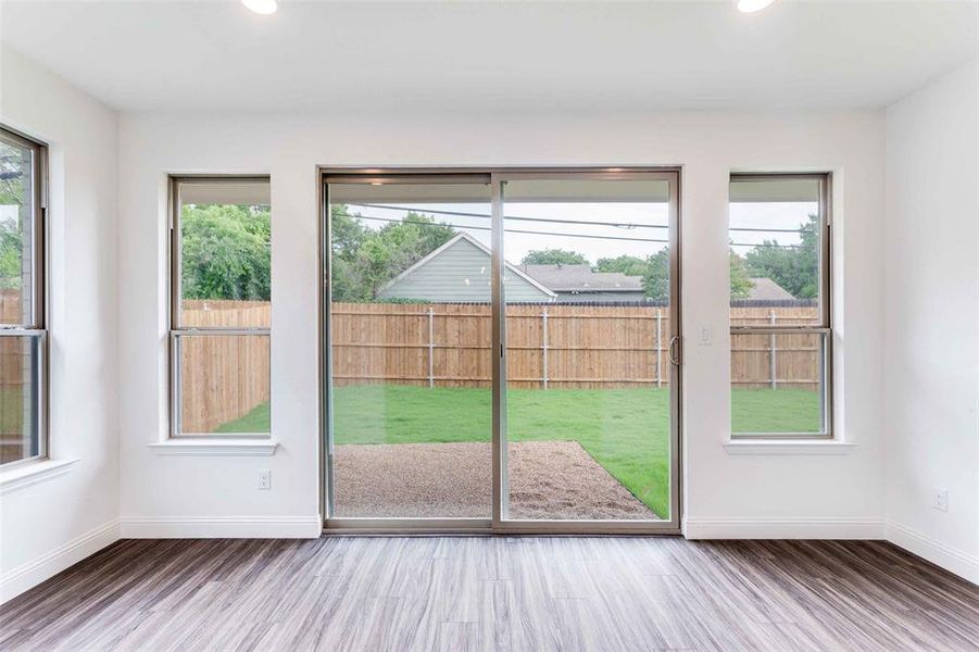 Entryway featuring a wealth of natural light and dark wood-type flooring