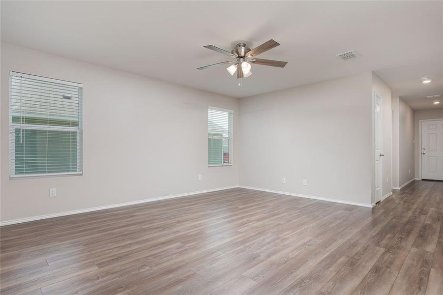 Spare room featuring ceiling fan and hardwood / wood-style floors