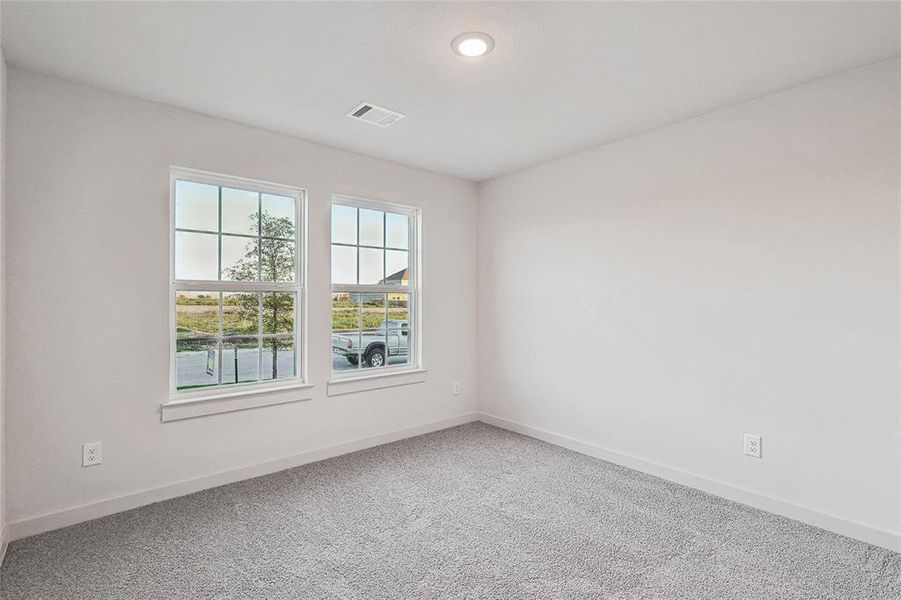 Empty room featuring carpet floors