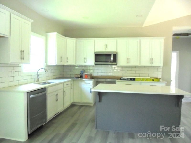 Kitchen- Quartz counter tops -add bar stools and you are all set!