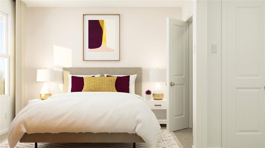 Bedroom featuring light colored carpet