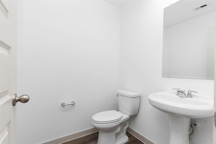 Wonderful Half Bathroom for your Guest with Beautiful Wood Vinyl Plank Flooring and also Elongated Commode! **Image Representative of Plan Only and May Vary as Built**