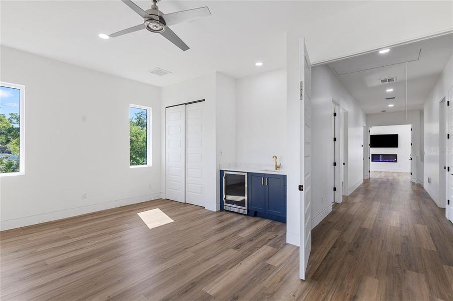 5th bedroom with wet bar and beverage fridge