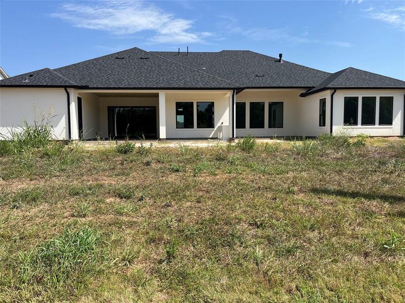 The rear elevation--huge back yard with room for a pool and much more! The rear fence will be brick per the developer.