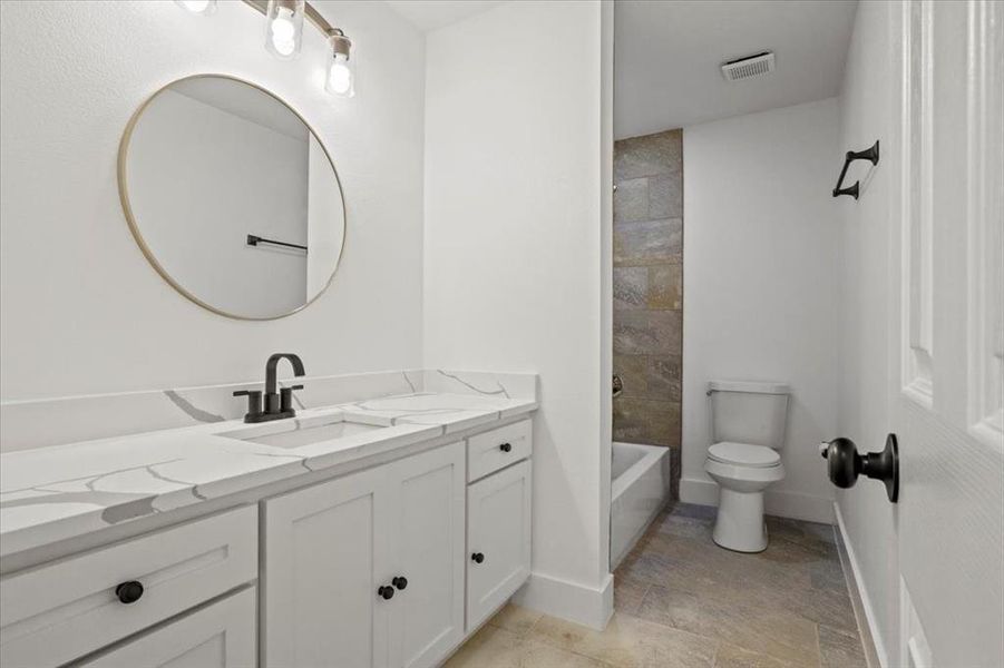 Bathroom featuring toilet and vanity