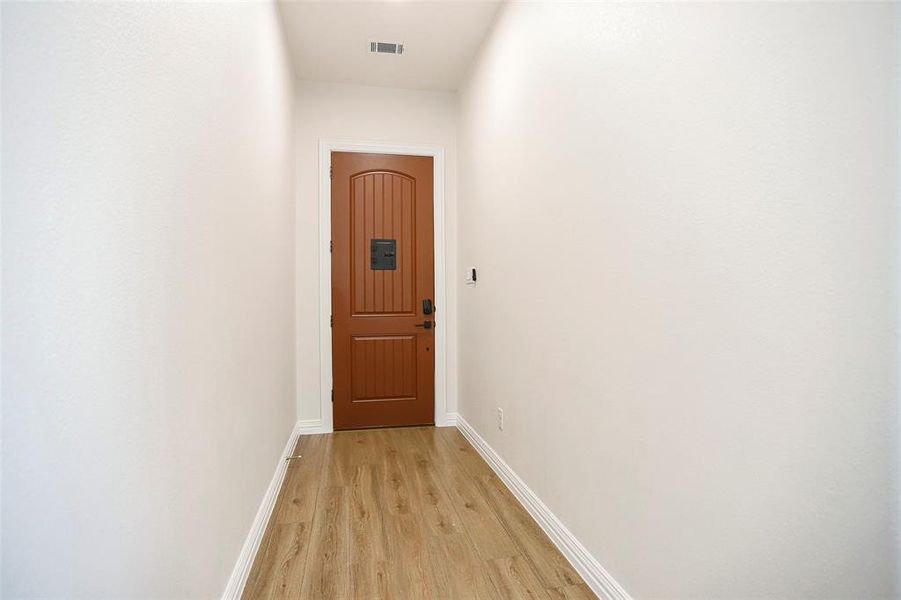 Hallway featuring light hardwood / wood-style floors