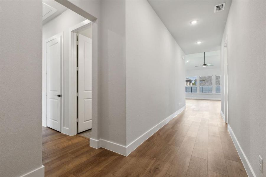 Corridor featuring dark wood-type flooring