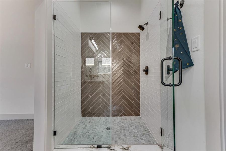 Primary bathroom shower with glass door