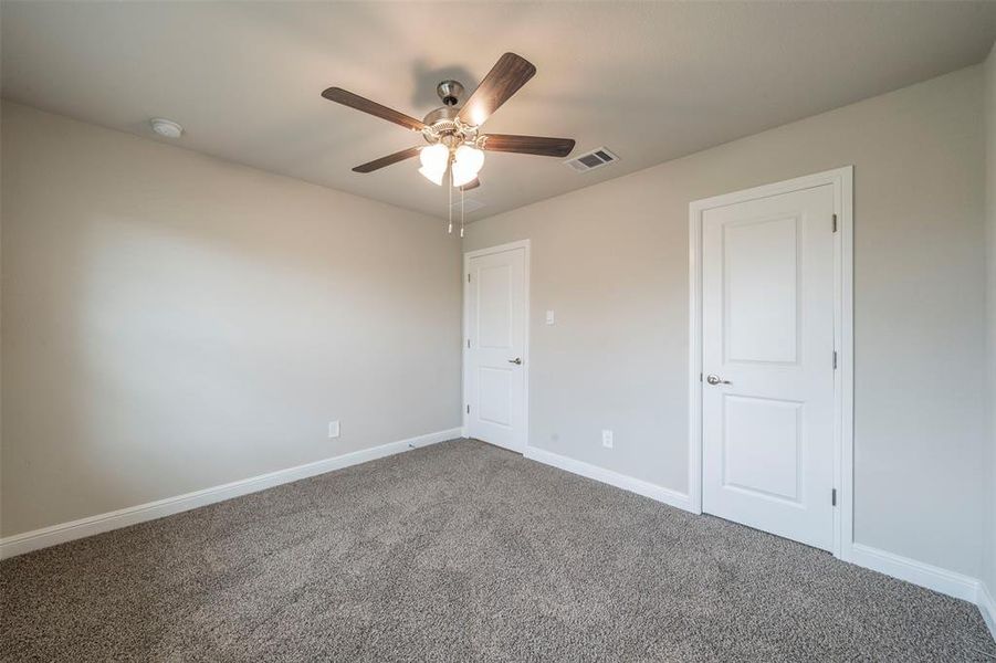 Another view of bedroom across from laundry