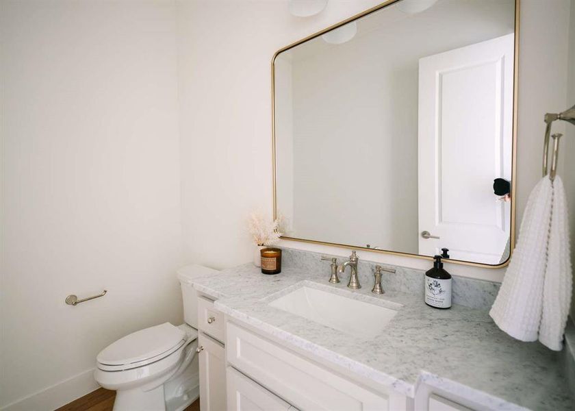 Bathroom featuring vanity and toilet