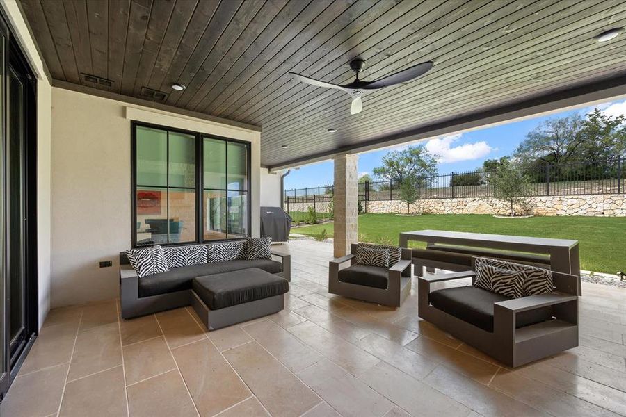 View of patio / terrace featuring ceiling fan and an outdoor hangout area